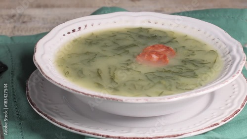 Caldo verde popular soup in Portuguese cuisine. traditional ingredients for caldo verde are potatoes, collard greens , olive oil and salt. Additionally garlic or onion may be added. photo