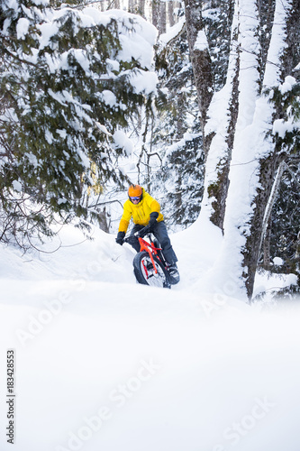 Man riding a fat bike in the snow during winter