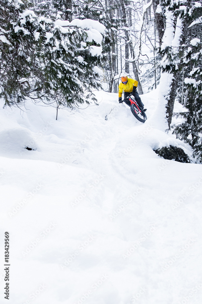 Man riding a fat bike in the snow during winter