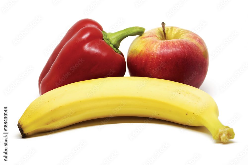 Apple, pepper and banana on white background