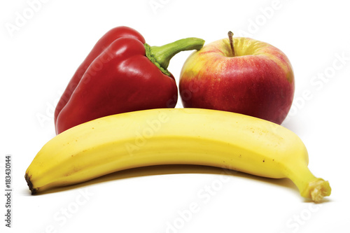 Obraz na płótnie Apple, pepper and banana on white background w salonie
