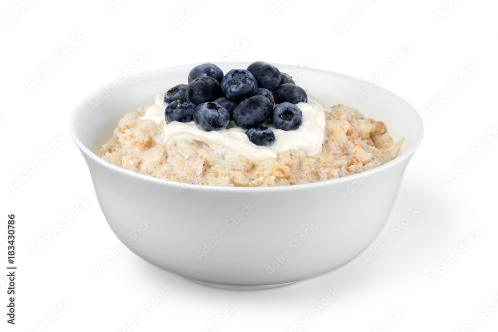 Isolated white bowl with fresh porridge on the white Isolated white bowl with fresh porridge on the white