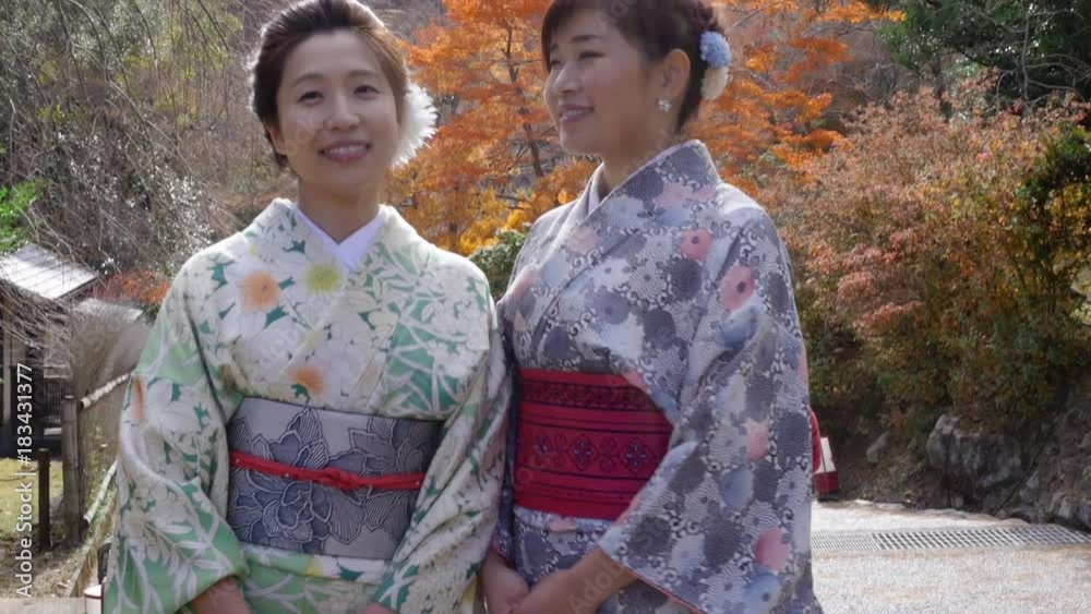 Beautuful Japanese women turn to give peace sign. Beautuful Japanese women turn to give peace sign.