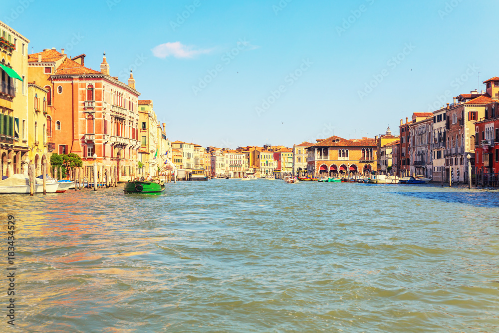 Picturesque summer view of Venice with famous water canals  and colorful historical buildings.