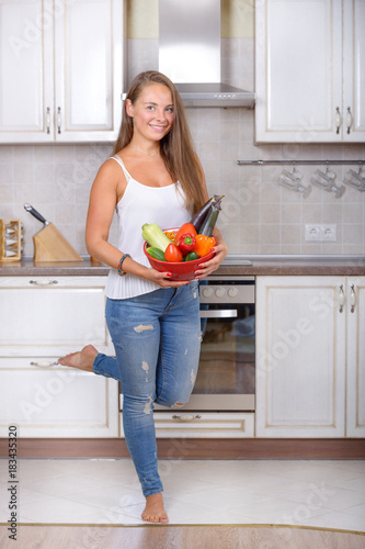 Happy girl with fresh vegetable