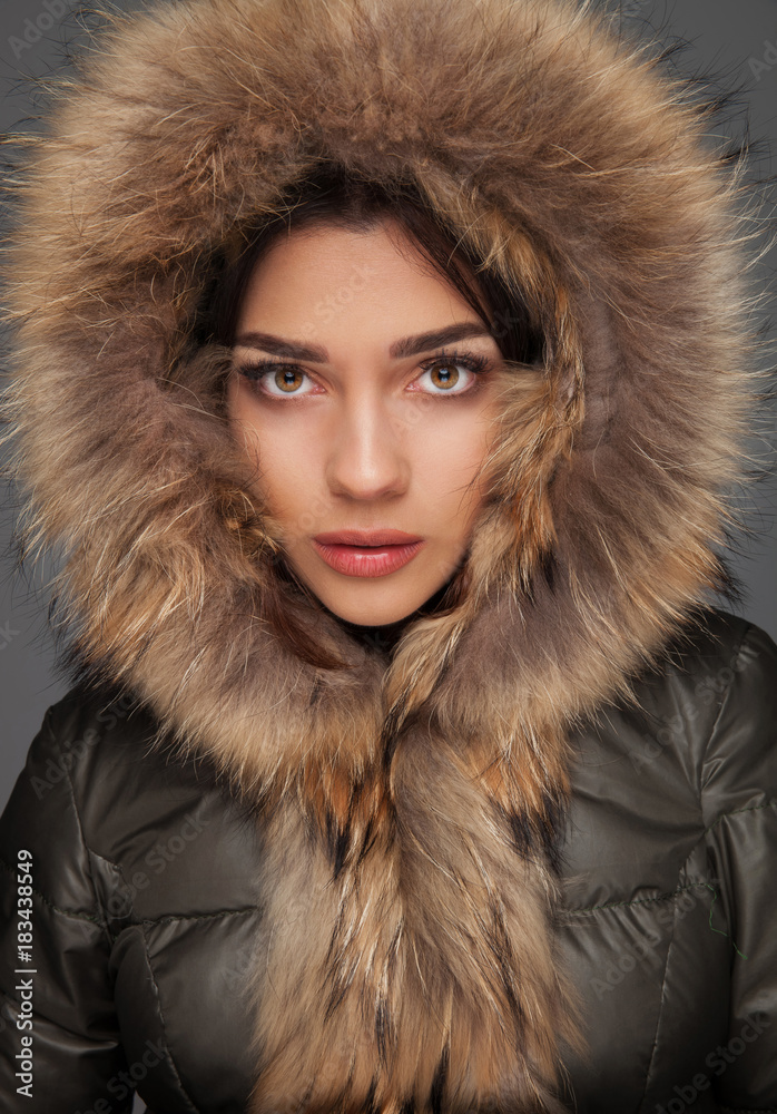 portrait of a beautiful woman with fur hood on head portrait of a beautiful woman with fur hood on head