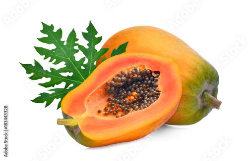 whole and half ripe papaya with green leaf isolated on white background