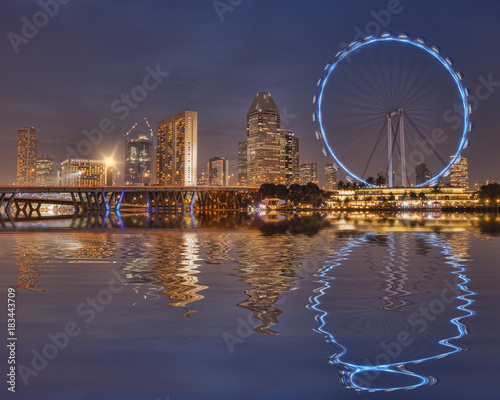 Singapore Flyer and Skyline reflected in the waters of Marina Bay