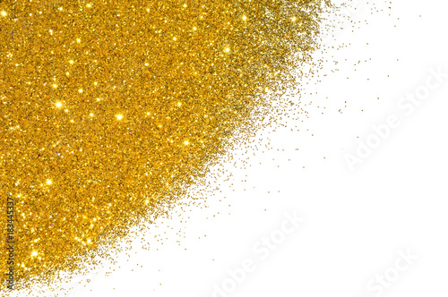 Textured background with golden glitter sparkle on white photo