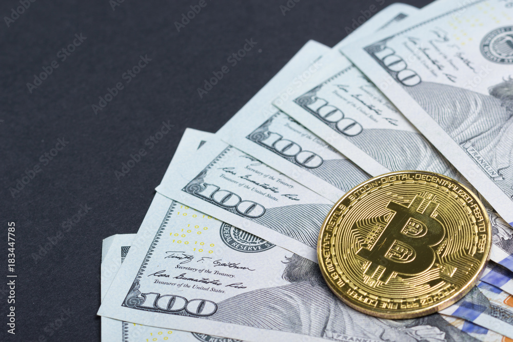 Bitcoin golden coin New virtual money and dollar background . Cryptocurrency. Business and Trading concept. Close-up shot Bitcoin golden coin New virtual money and dollar background . Cryptocurrency. Business and Trading concept. Close-up shot