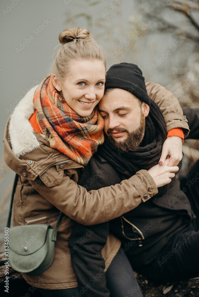 Portrait of couple walking through pathway on hill. Man and woman enjoying vacation in countryside. Young people hiking in nature. Portrait of couple walking through pathway on hill. Man and woman enjoying vacation in countryside. Young people hiking in nature.