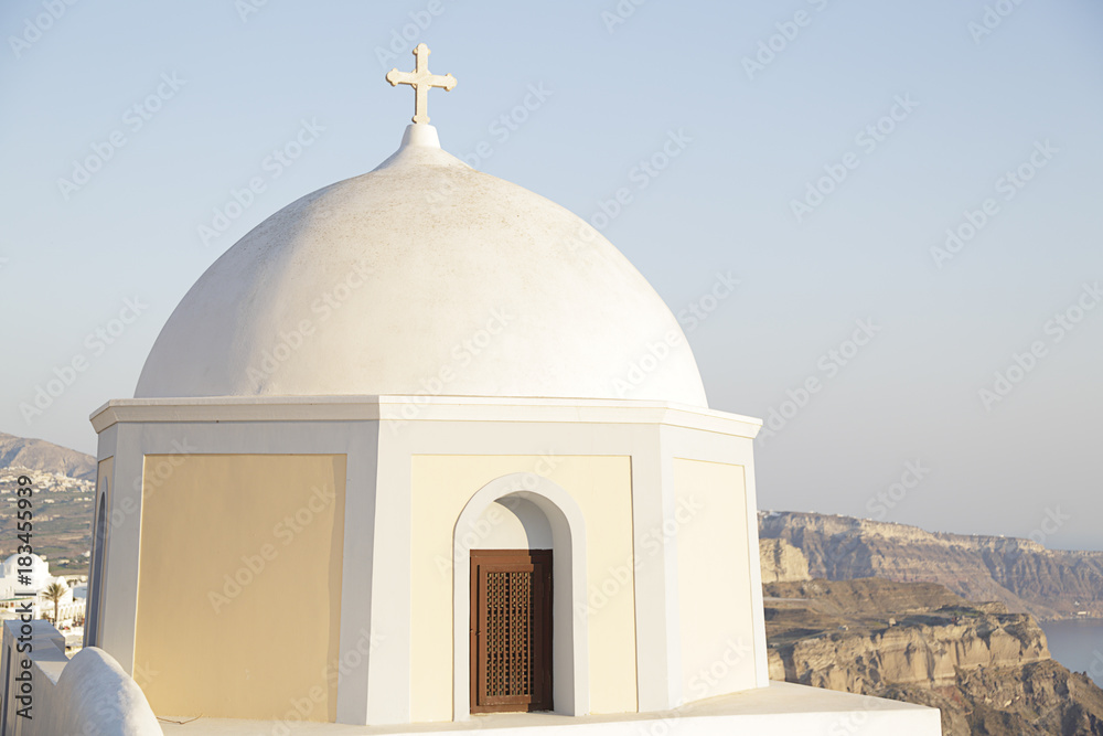 Beautiful blue and yellow church dome located in the town of Fira on Santorini island, Greece