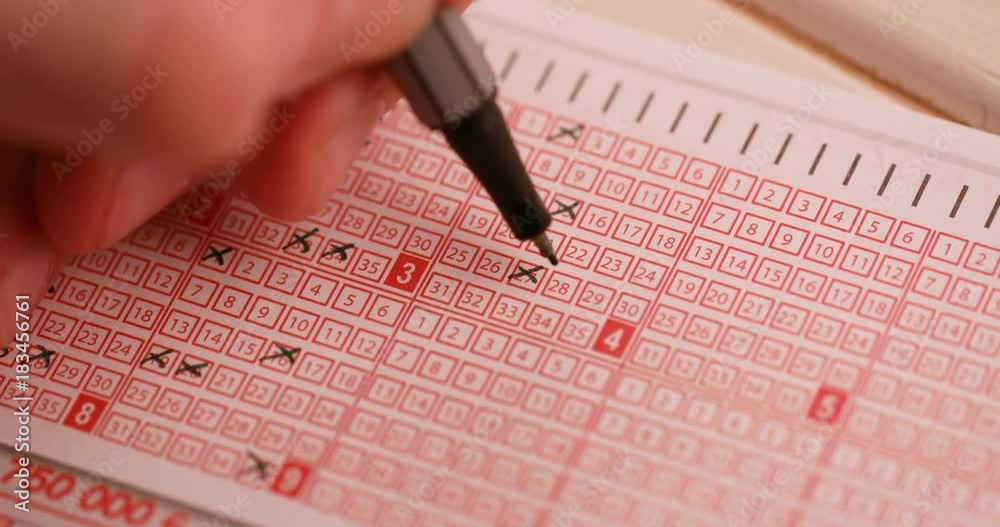 fill out a lottery ticket hand with pen cross out numbers fill out a lottery ticket hand with pen cross out numbers