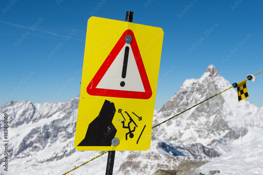 Danger sign on ski slopes in winter mountains Danger sign on ski slopes in winter mountains