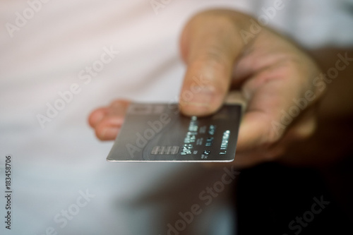 Male hand showing and holding credit card