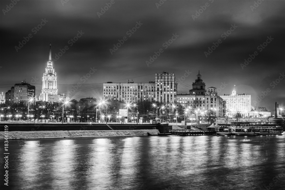 Beautiful cityscape, Moscow at night, the capital of Russia, city lights and reflection in the river, black and white image