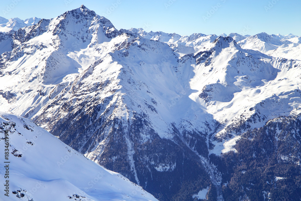 High mountains under snow in the winter. Slope on the skiing resort, European Alps