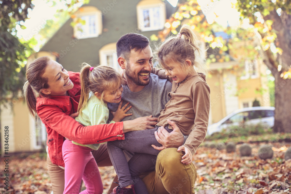 Smiling family spending time together. Autumn season. Smiling family spending time together. Autumn season.