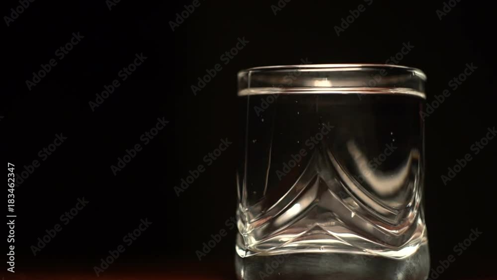 Soda water in a glass on a dark background Soda water in a glass on a dark background