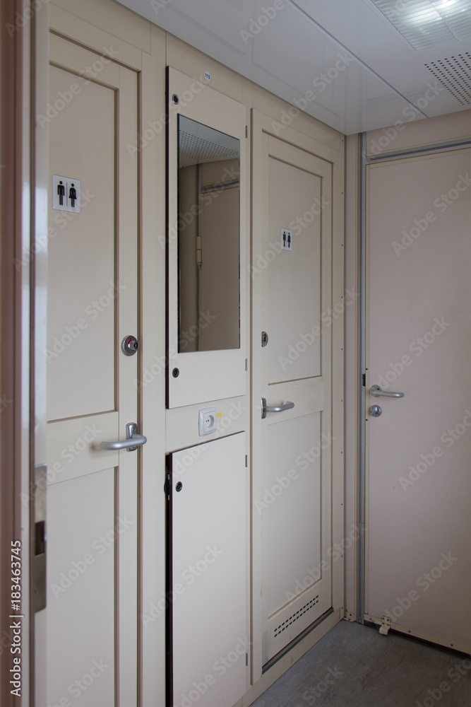 Train interior, restrooms is busy