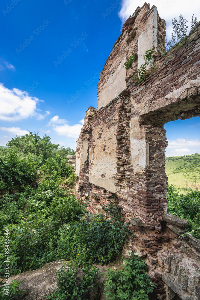 Walls of ruined abandoned Chervonohorod Castle over Dnister River Valley landscape park in Ukraine