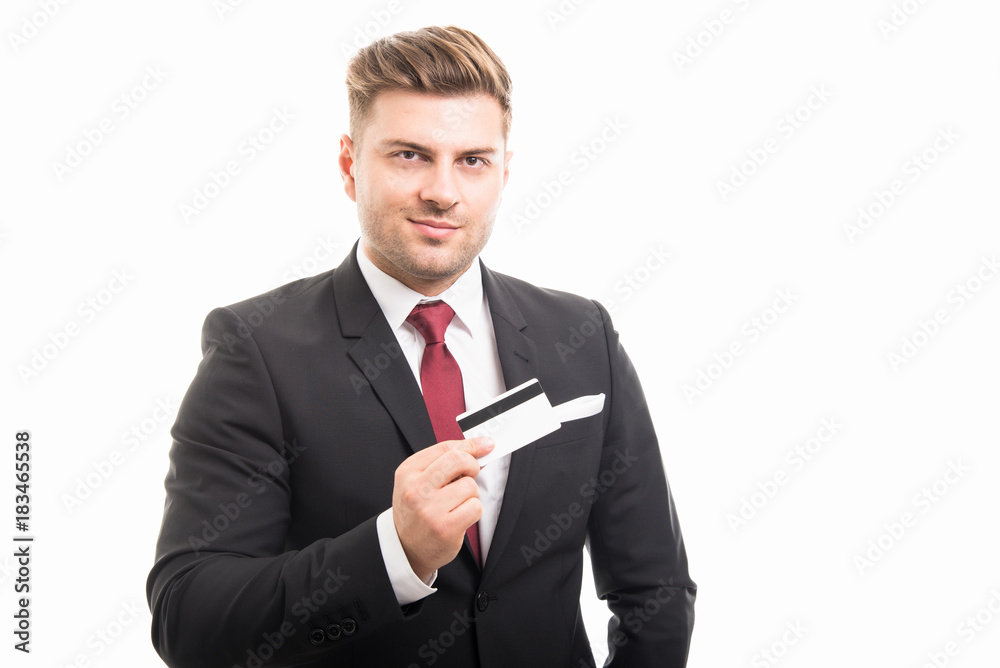 Handsome manager holding credit or debit card Handsome manager holding credit or debit card
