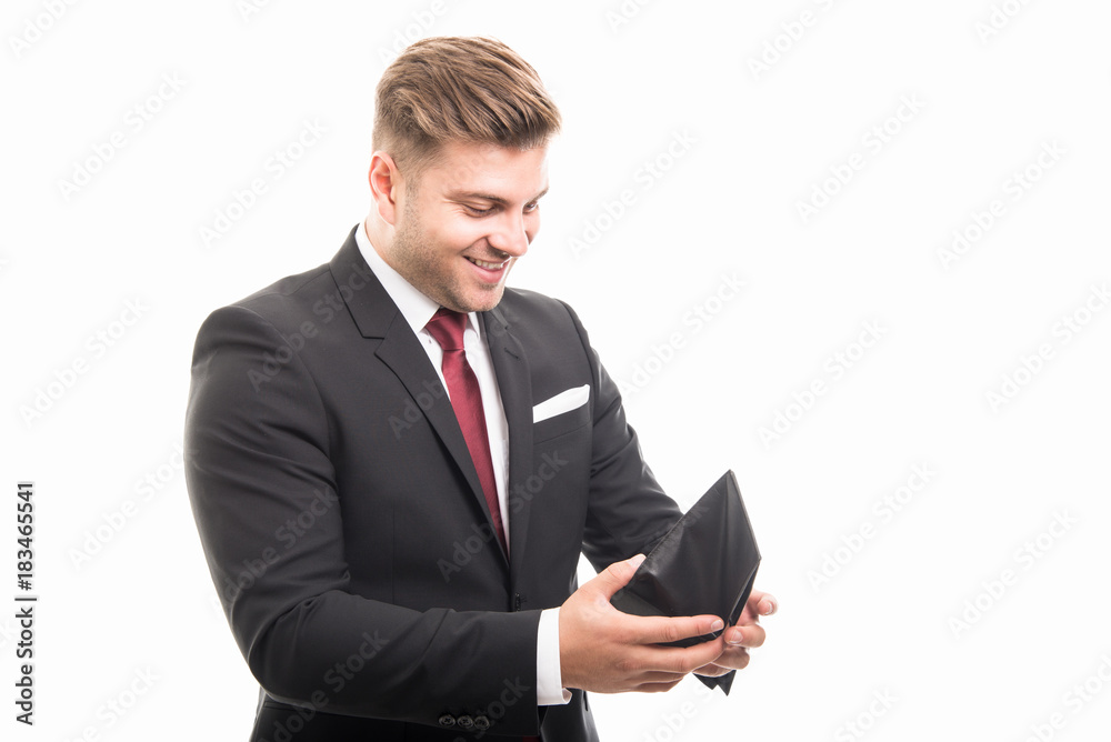 Handsome manager holding wallet looking happy Handsome manager holding wallet looking happy