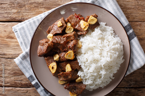 spicy beef salpicao with garlic and rice closeup on a table. Horizontal top view photo