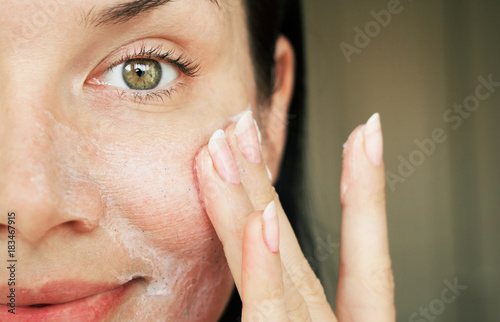 purification of the face. girl washed with scrub to clean the pores.