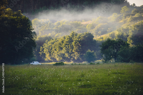 Meadow in Dzhuryn river valley near famous Dzhurynskyi waterfall in Ukraine photo