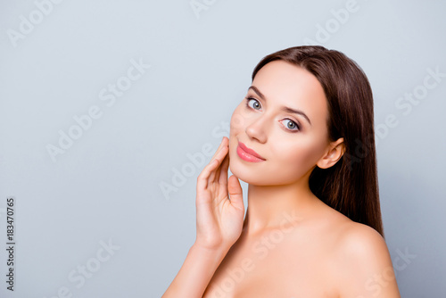 Portrait with copy space of young woman  showing her perfect  clean  fresh skin after bathroom. Cosmetology  beauty and spa