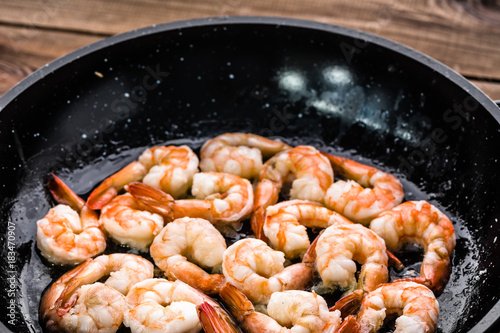 Grilled shrimp, preparing seafood dish, mediterranean diet concept