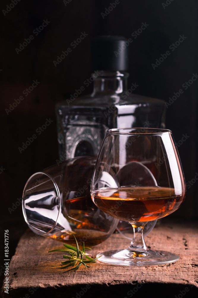 Glass of brandy or cognac and bottle Glass of brandy or cognac and bottle