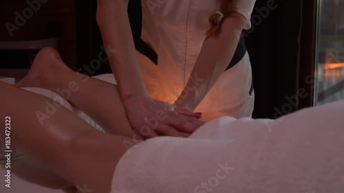 Wallpaper Mural Young beautiful woman lies on couch in spa and enjoys back massage	 Torontodigital.ca