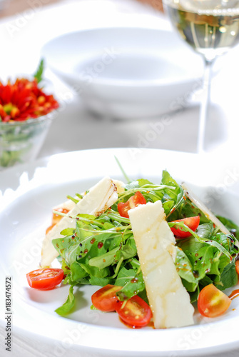 Fresh healthy salad and white wine