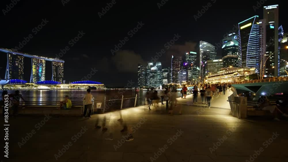 Singapore - November 27, 2017: Zoom in timelapse of Singapore cityscape and pedestrian at night from Esplanade Bridge. Shot in 4k resolution Singapore - November 27, 2017: Zoom in timelapse of Singapore cityscape and pedestrian at night from Esplanade Bridge. Shot in 4k resolution