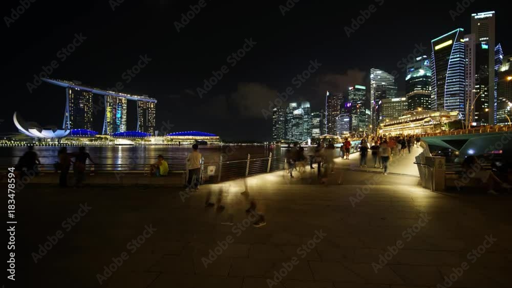 Singapore - November 27, 2017: Beautiful cityscape of Marina Bay Sands Singapore at night from Esplanade Bridge. Shot in 4k resolution Singapore - November 27, 2017: Beautiful cityscape of Marina Bay Sands Singapore at night from Esplanade Bridge. Shot in 4k resolution