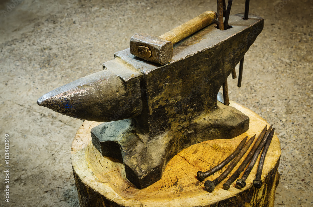 Iron anvil and blacksmith's tools / The picture is taken in the production room Iron anvil and blacksmith's tools / The picture is taken in the production room