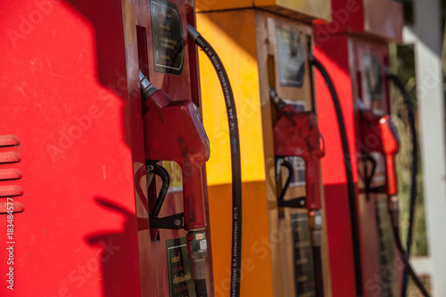 Wallpaper Mural Colorful Petrol pump filling nozzles isolated on white background , Gas station in a service in warm sunset Torontodigital.ca