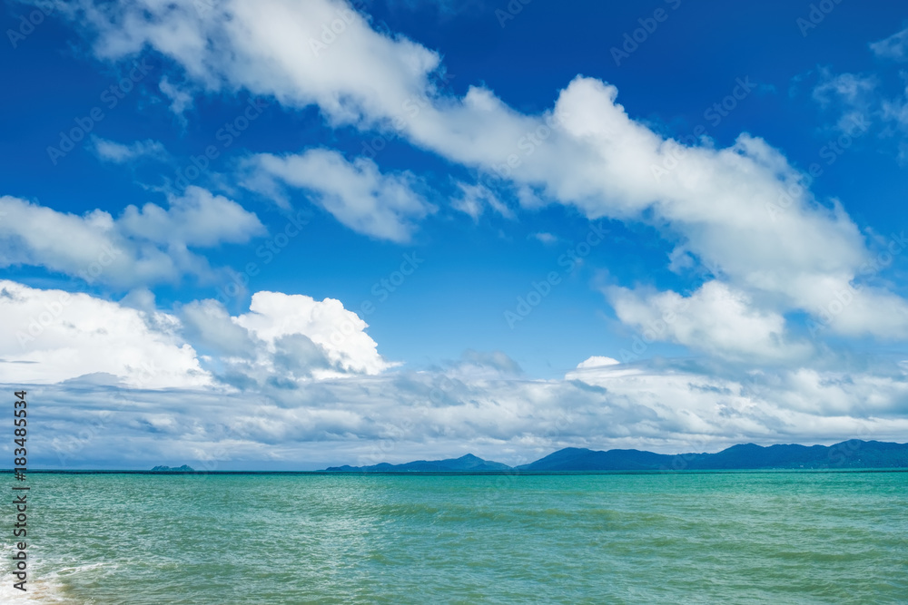 Beautiful seascape with sea waves and cloudy blue sky, Maenam beach, Koh Samui, Thailand.