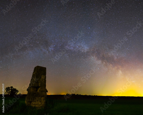 night scene, old tower on a milky way background