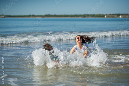 Young couple bathing in the sea.