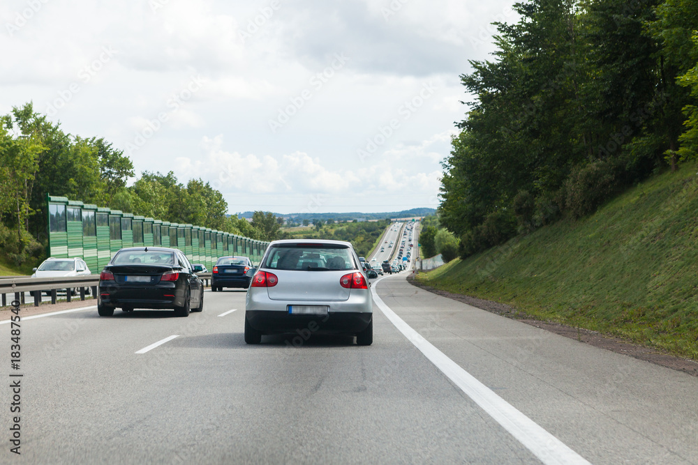Fototapeta premium Driving a car on the highway in good weather conditions