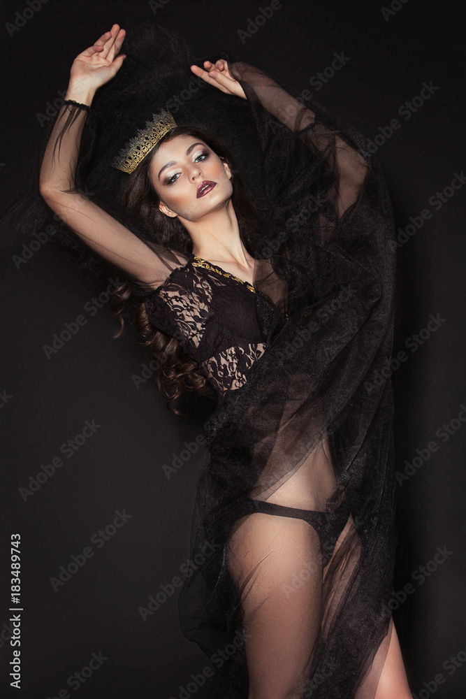 A beautiful, sensual girl, model in a glamorous, fashionable image posing in a photo studio with color filters. Fashion, style, beauty, portrait. A beautiful, sensual girl, model in a glamorous, fashionable image posing in a photo studio with color filters. Fashion, style, beauty, portrait.