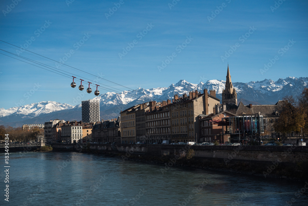 Panoramic view of The Grenoble-Bastille cable car, the Isere river and the Belledonne mountain range in the background.