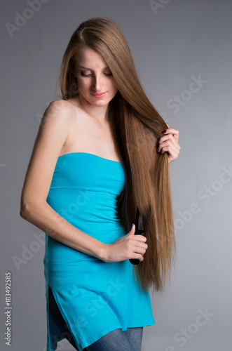 young woman with long beautiful hair © Evgenia Tiplyashina