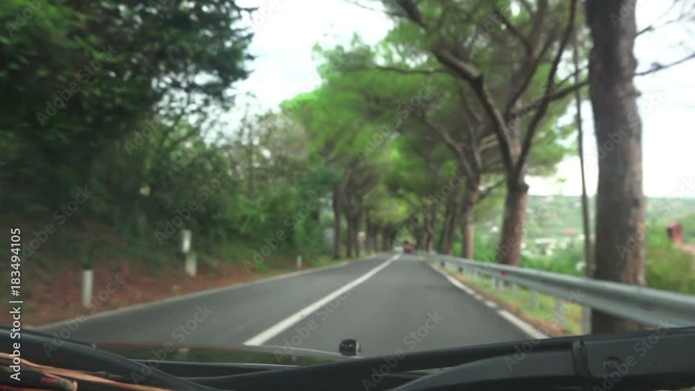Drivers pov through car windshield, driving vehicle on the road through mediterranean countryside Drivers pov through car windshield, driving vehicle on the road through mediterranean countryside