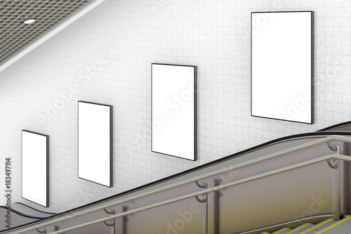 Blank advertising poster on underground escalator wall