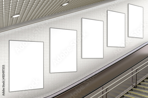 Blank advertising poster on underground escalator wall