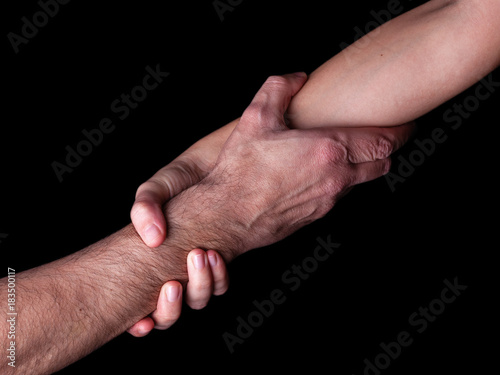 Photography Woman saving, rescuing and helping man by holding or griping the forearm